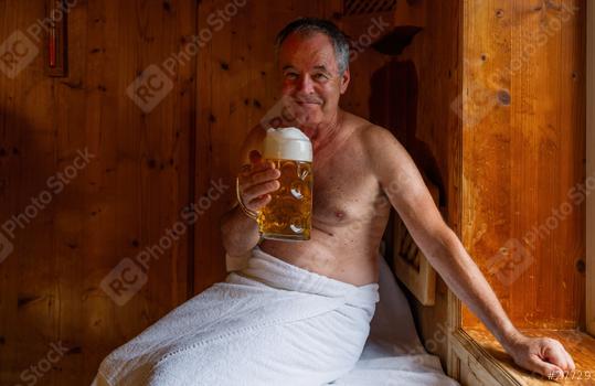 Smiling man in sauna holding german beer mug, towel wrapped around waist. Spa Wellness concept image  : Stock Photo or Stock Video Download rcfotostock photos, images and assets rcfotostock | RC Photo Stock.: