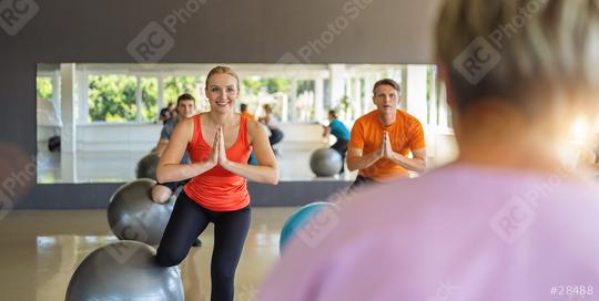 smiling woman flexing leg muscles with exercise ball in gym and folding hands. Healthy sports lifestyle, Fitness, Healthy concept.  : Stock Photo or Stock Video Download rcfotostock photos, images and assets rcfotostock | RC Photo Stock.: