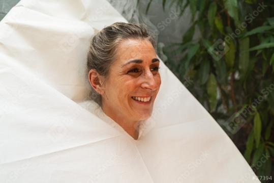 Smiling woman wrapped in a seat steam sauna, with greenery in the background at a wellness hotel  : Stock Photo or Stock Video Download rcfotostock photos, images and assets rcfotostock | RC Photo Stock.: