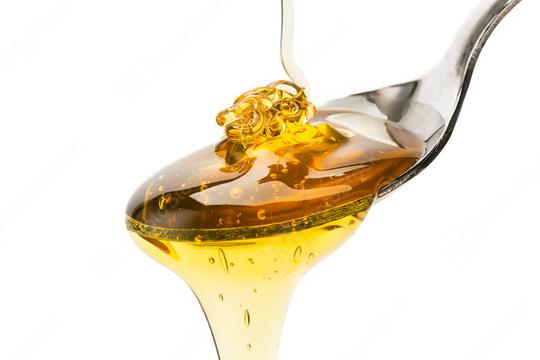 spoon with pouring honey  : Stock Photo or Stock Video Download rcfotostock photos, images and assets rcfotostock | RC Photo Stock.: