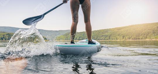 Sporty girl stand up paddle surfing   : Stock Photo or Stock Video Download rcfotostock photos, images and assets rcfotostock | RC Photo Stock.: