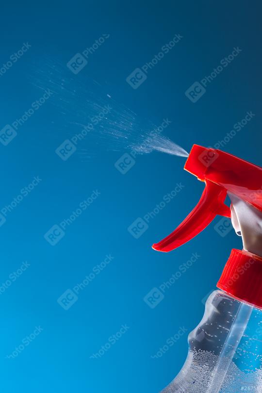 spray bottle against blue background  : Stock Photo or Stock Video Download rcfotostock photos, images and assets rcfotostock | RC Photo Stock.: