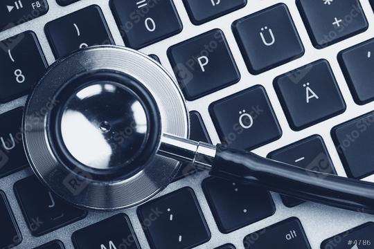 Stethoscope lying on laptop keyboard. Laptop infected by virus concept image  : Stock Photo or Stock Video Download rcfotostock photos, images and assets rcfotostock | RC Photo Stock.: