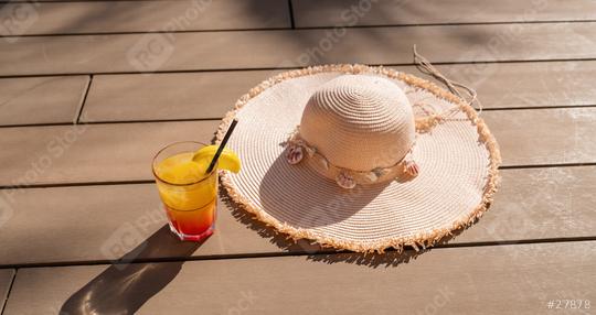 Summer cocktail with straw hat on a wooden deck, symbolizing relaxation and vacation vibes  : Stock Photo or Stock Video Download rcfotostock photos, images and assets rcfotostock | RC Photo Stock.: