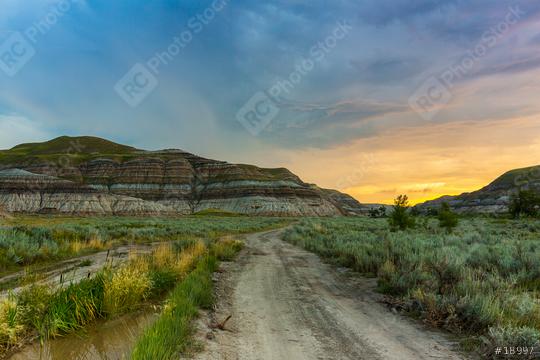 sundawn on a cloudy sky at drumheller mountans canada  : Stock Photo or Stock Video Download rcfotostock photos, images and assets rcfotostock | RC-Photo-Stock.: