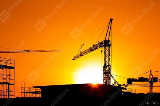 Sunset behind a Construction site silhouette building with cranes  : Stock Photo or Stock Video Download rcfotostock photos, images and assets rcfotostock | RC Photo Stock.: