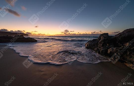 Sunset view at the beach with waves gently crashing against rocks under a colorful sky  : Stock Photo or Stock Video Download rcfotostock photos, images and assets rcfotostock | RC Photo Stock.: