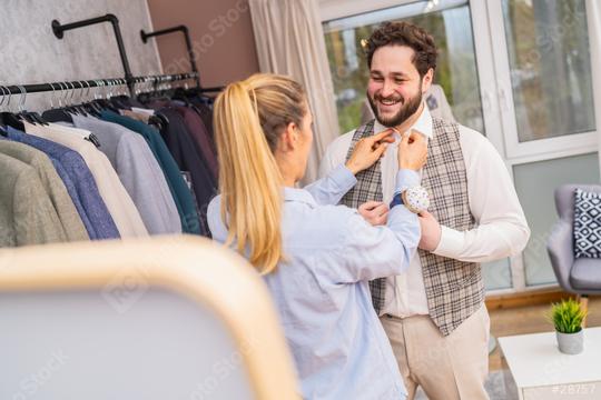 tailor adjusting a vest on a smiling man in a boutique with clothes racks
  : Stock Photo or Stock Video Download rcfotostock photos, images and assets rcfotostock | RC Photo Stock.: