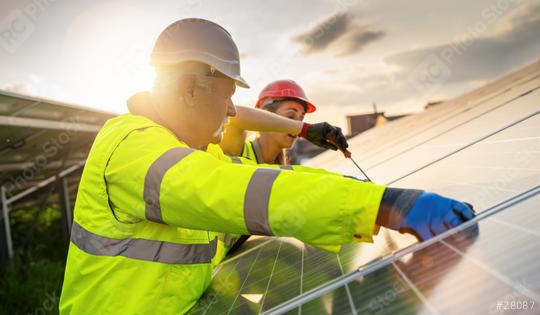 Team of engineers working on the maintenance of solar panels at sunset. Alternative energy ecological concept image.  : Stock Photo or Stock Video Download rcfotostock photos, images and assets rcfotostock | RC Photo Stock.: