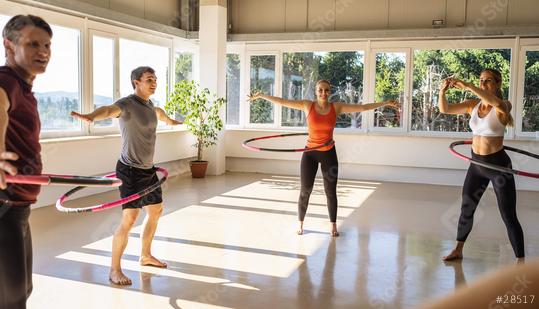 Team Sport group of people doing hula hoop in step waist hooping forward stance in fitness gym for healthy lifestyle concept.  : Stock Photo or Stock Video Download rcfotostock photos, images and assets rcfotostock | RC Photo Stock.: