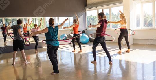 Team Sport Sporty women and men exercising with Hula hoop in fitness gym for healthy lifestyle concept.  : Stock Photo or Stock Video Download rcfotostock photos, images and assets rcfotostock | RC Photo Stock.: