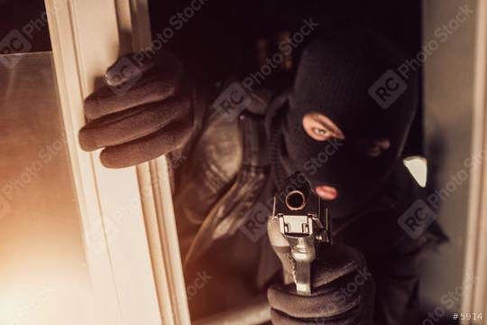Terrorist or a thief pointing a gun in to a House  : Stock Photo or Stock Video Download rcfotostock photos, images and assets rcfotostock | RC Photo Stock.: