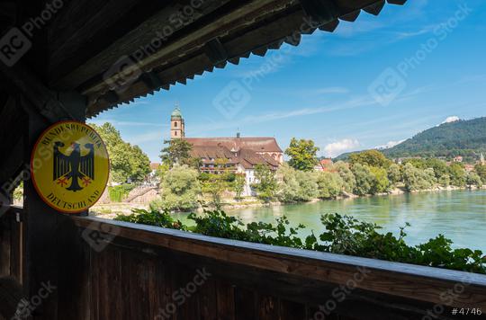 The border to Germany at the historic wooden bridge and Fridolins minster in Bad Saeckingen at summer, Black Forest, Baden-Wurttemberg, Germany, Europe  : Stock Photo or Stock Video Download rcfotostock photos, images and assets rcfotostock | RC Photo Stock.: