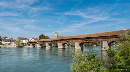 The historic wood border bridge over Rhine river and Fridolins minster in Bad Saeckingen at summer, Black Forest, Baden-Wurttemberg, Germany, Europe  : Stock Photo or Stock Video Download rcfotostock photos, images and assets rcfotostock | RC Photo Stock.: