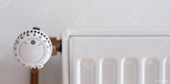 thermostatic radiator valve set to low temperature on a white wall, with copyspace for your individual text.  : Stock Photo or Stock Video Download rcfotostock photos, images and assets rcfotostock | RC Photo Stock.: