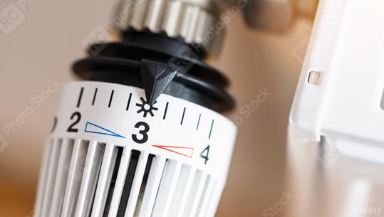 thermostatic radiator valve set to middle temperature, symbol for saving money at heating costs  : Stock Photo or Stock Video Download rcfotostock photos, images and assets rcfotostock | RC Photo Stock.: