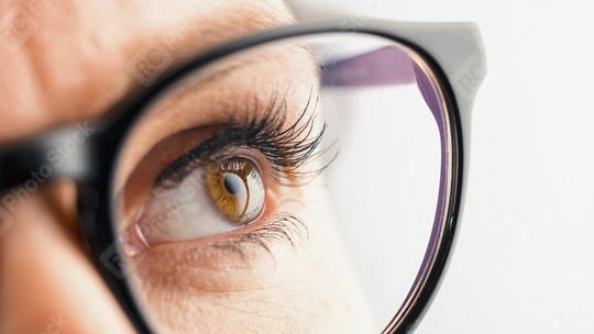 Thoughtful Female eye with glasses  : Stock Photo or Stock Video Download rcfotostock photos, images and assets rcfotostock | RC-Photo-Stock.: