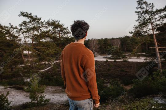 Thoughtful young man looks at the beautiful nature. People are future-oriented and positive thinking in the forest.  : Stock Photo or Stock Video Download rcfotostock photos, images and assets rcfotostock | RC Photo Stock.: