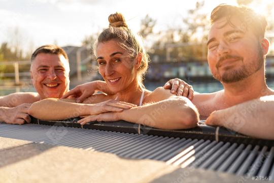 Three friends smiling and relaxing in a pool at a hotel, basking  : Stock Photo or Stock Video Download rcfotostock photos, images and assets rcfotostock | RC Photo Stock.: