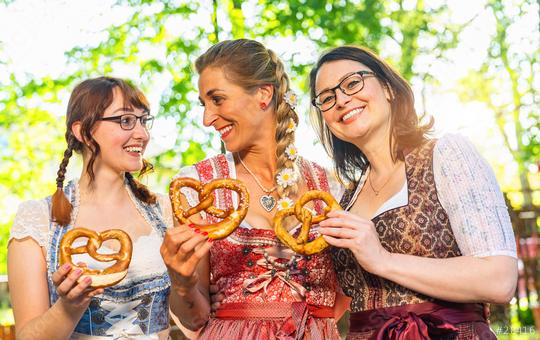 Three girl friends, having fun in beer garden holding  Traditional Bavaria pretzels, Germany  : Stock Photo or Stock Video Download rcfotostock photos, images and assets rcfotostock | RC Photo Stock.: