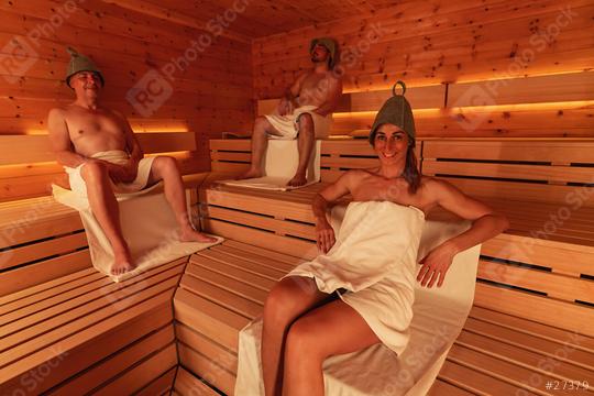 Three people in a sauna wearing finnish felt hats, two men seated and a woman reclining  : Stock Photo or Stock Video Download rcfotostock photos, images and assets rcfotostock | RC Photo Stock.: