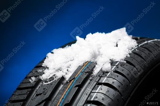 Tire with snow heap at the winter on blue blackground  : Stock Photo or Stock Video Download rcfotostock photos, images and assets rcfotostock | RC Photo Stock.: