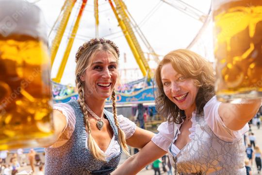 Toasting at oktoberfest or duld in Bavarian, with big beer mugs at summer  : Stock Photo or Stock Video Download rcfotostock photos, images and assets rcfotostock | RC Photo Stock.: