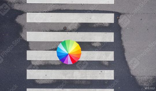 Top view of a rainbow umbrella on a pedestrian crosswalk  : Stock Photo or Stock Video Download rcfotostock photos, images and assets rcfotostock | RC Photo Stock.: