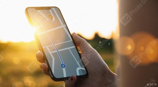 Tourist using GPS map navigation app on smartphone screen to get direction to destination address in the landscape, travel and technology concept image  : Stock Photo or Stock Video Download rcfotostock photos, images and assets rcfotostock | RC Photo Stock.: