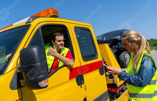 Tow truck operator giving thumbs up to woman with smart phone by damaged car. Roadside assistance concept image.  : Stock Photo or Stock Video Download rcfotostock photos, images and assets rcfotostock | RC Photo Stock.: