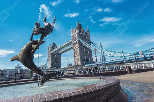 Tower Bridge and statue of a girl playing with dolphin in St Katharine docks in London.  : Stock Photo or Stock Video Download rcfotostock photos, images and assets rcfotostock | RC Photo Stock.: