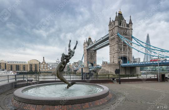 Tower bridge Girl and Dolphin statue against on a cloudy day  : Stock Photo or Stock Video Download rcfotostock photos, images and assets rcfotostock | RC Photo Stock.: