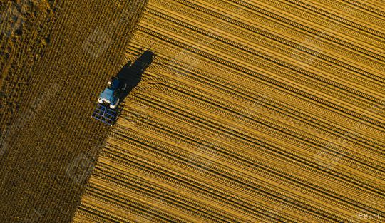 tractor ploughing a field. Industrial background on agricultural theme. Use drones to inspect of your business.   : Stock Photo or Stock Video Download rcfotostock photos, images and assets rcfotostock | RC Photo Stock.: