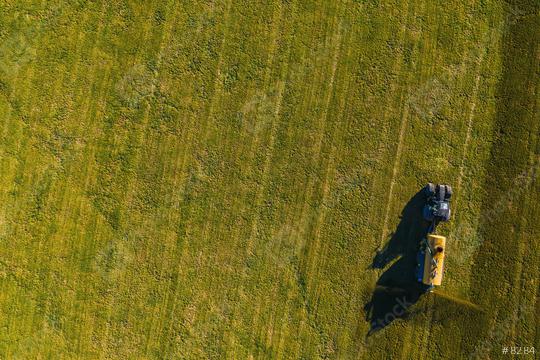 tractor sprays its manure from the tanker onto a field. Industrial background on agricultural theme. Use drones to inspect of your business.  : Stock Photo or Stock Video Download rcfotostock photos, images and assets rcfotostock | RC Photo Stock.: