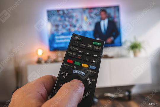 TV remote control, the hand with a remote control, pov view  : Stock Photo or Stock Video Download rcfotostock photos, images and assets rcfotostock | RC Photo Stock.: