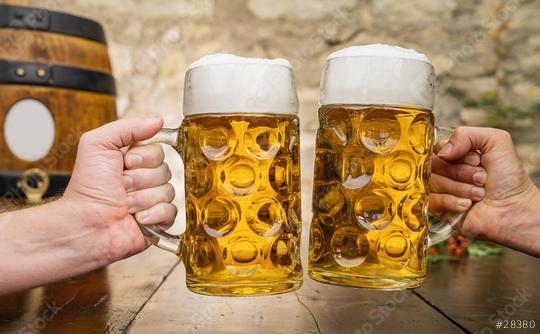 Two hands toasting with glasses with german beer and wooden barrel, Munich, Germany  : Stock Photo or Stock Video Download rcfotostock photos, images and assets rcfotostock | RC Photo Stock.: