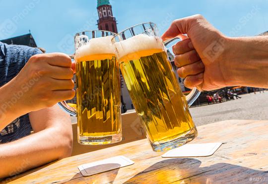 two human hands toast with glasses of german beer in Frankfurt  : Stock Photo or Stock Video Download rcfotostock photos, images and assets rcfotostock | RC Photo Stock.: