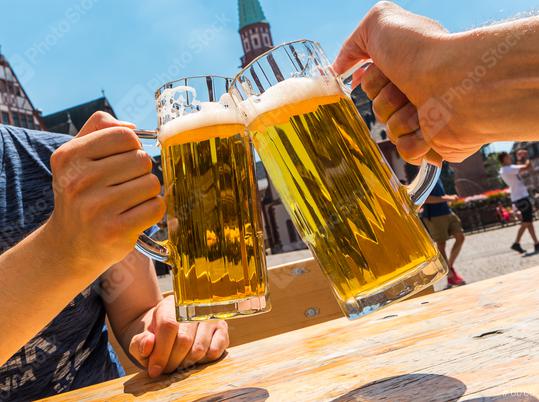 two mans holding beer mug at a beer garden in germany  : Stock Photo or Stock Video Download rcfotostock photos, images and assets rcfotostock | RC Photo Stock.: