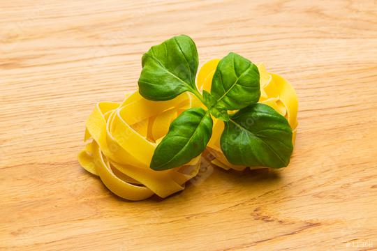 two pasta noodle nests with basil  : Stock Photo or Stock Video Download rcfotostock photos, images and assets rcfotostock | RC Photo Stock.: