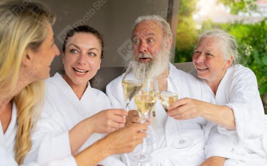 Two women and a senior couple laughing and toasting with champagne glasses at a spa wellnes hotel  : Stock Photo or Stock Video Download rcfotostock photos, images and assets rcfotostock | RC Photo Stock.: