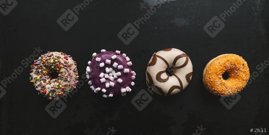 various baked donuts in a row, sweet food  : Stock Photo or Stock Video Download rcfotostock photos, images and assets rcfotostock | RC Photo Stock.: