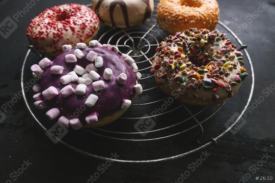 various baked donuts on a bakery grid, sweet food  : Stock Photo or Stock Video Download rcfotostock photos, images and assets rcfotostock | RC Photo Stock.:
