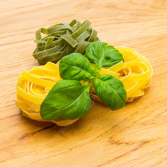 various ribbon pasta nests with basil  : Stock Photo or Stock Video Download rcfotostock photos, images and assets rcfotostock | RC Photo Stock.: