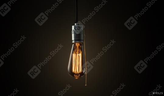Vintage Edison lightbulb on dark background with bright yellow shining wire  : Stock Photo or Stock Video Download rcfotostock photos, images and assets rcfotostock | RC Photo Stock.: