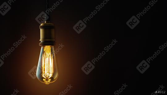 Vintage hanging Edison light bulb over dark background  : Stock Photo or Stock Video Download rcfotostock photos, images and assets rcfotostock | RC Photo Stock.: