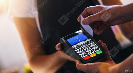 Waiter holding credit card swipe machine while customer swiping card. Woman making payment in cafeteria with credit card. Customer paying for coffee and brunch by credit card reader.  : Stock Photo or Stock Video Download rcfotostock photos, images and assets rcfotostock | RC Photo Stock.: