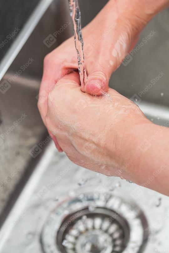 washing hands in the kitchen  : Stock Photo or Stock Video Download rcfotostock photos, images and assets rcfotostock | RC Photo Stock.: