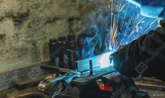 welder is welding metal part in car factory authentic close-up shot  : Stock Photo or Stock Video Download rcfotostock photos, images and assets rcfotostock | RC Photo Stock.: