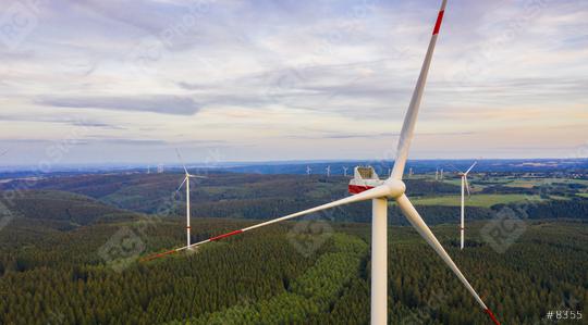 wind farm in the forest at sunset - energy production with clean and renewable energy - aerial shot  : Stock Photo or Stock Video Download rcfotostock photos, images and assets rcfotostock | RC Photo Stock.: