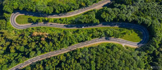 Winding road in the forest. Eifel, germany, Europe. Car passing on road. Drone Shot  : Stock Photo or Stock Video Download rcfotostock photos, images and assets rcfotostock | RC Photo Stock.: